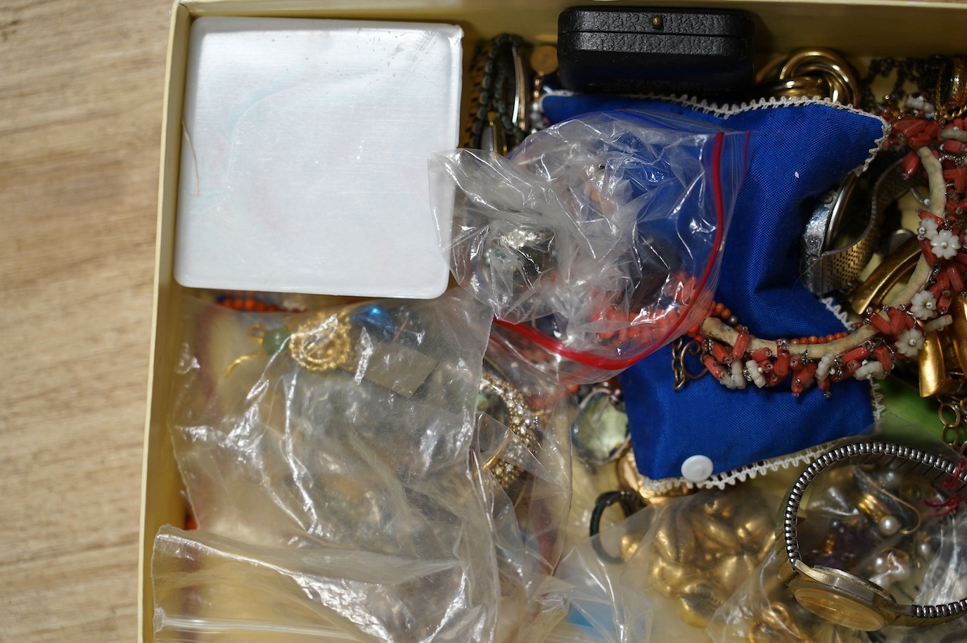 A quantity of assorted costume jewellery and wrist watches. Condition - poor to fair